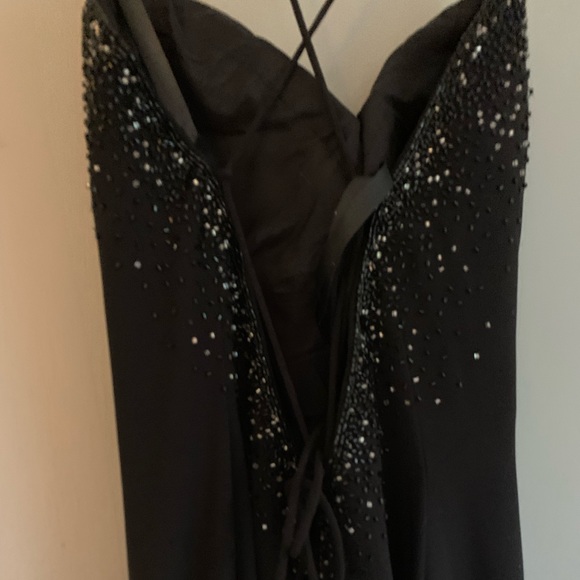 Black, backless, beautiful evening gown. Dry cleaned and no flaws. Size 10 - Picture 2 of 4